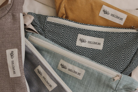 selection of not i but we upcycled cross body bags