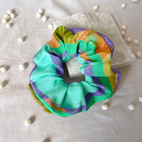 Colorful scrunchie on a white background with decorative elements