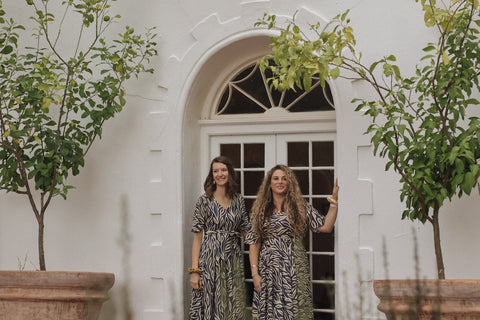 sisterhood dress infront of door