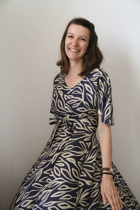 woman spinning in sisterhood dress