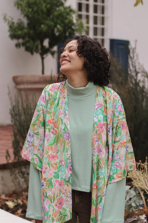 woman laughing wearing floral kimono