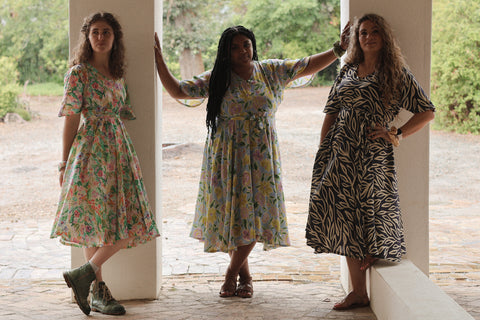 three women wearing sisterhood dress