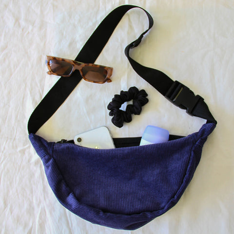 Blue Cross Body Bag filled with everyday essentials.