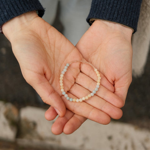 Breathe Bracelet presented on someone's hands.