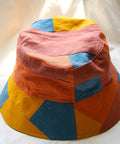 Coral Patchwork Bucket Hat with red, orange, and blue patches.