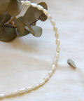 freshwater pearl necklace presented with a flower