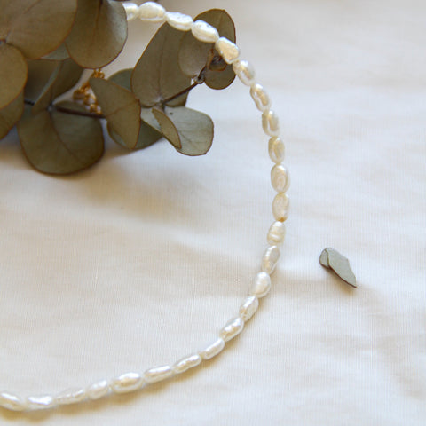 freshwater pearl necklace presented with a flower