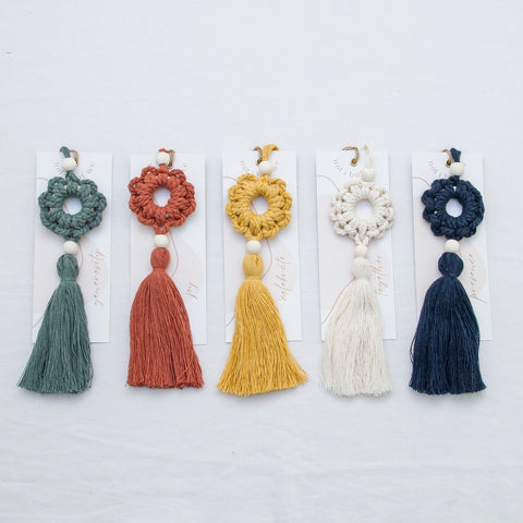 All five different large tassels with the matching card