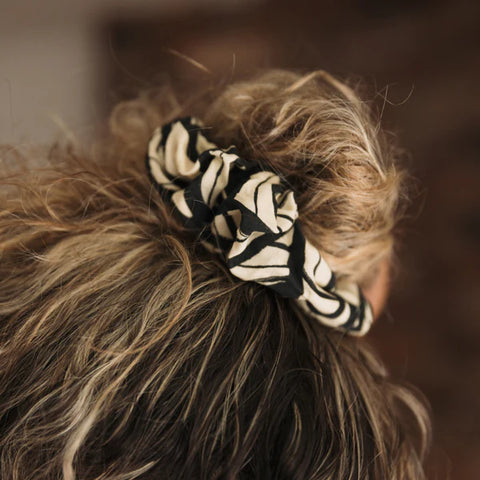 Leaf Scrunchy Worn by a woman with blond hair.