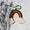 Mini macramé rainbow in green, gold, and red