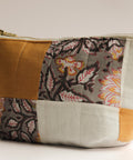 Patchwork pouch with floral patterns on a light background