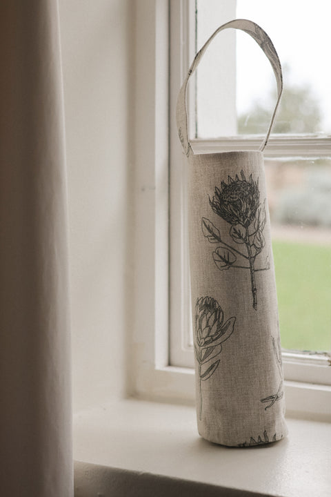 protea wine bag in windowsill