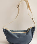 blue speckeled bag on white background