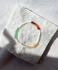 Beaded bracelet on a textured white surface