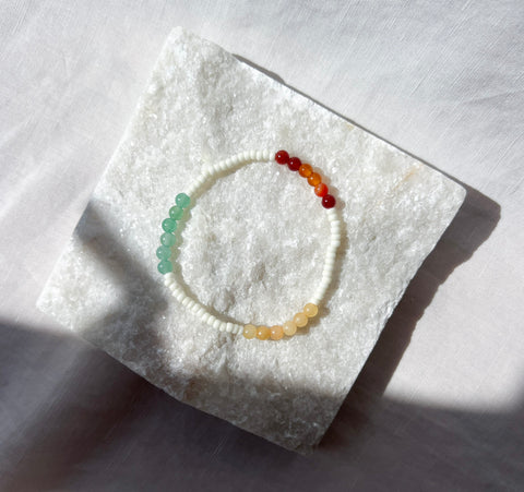 Beaded bracelet on a textured white surface