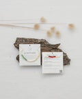 Product  Packaging with gratitude practice stop-look-go at the back.