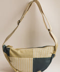 lemon stripes and teal patchwork bag on white background