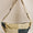 lemon stripes and teal patchwork bag on white background
