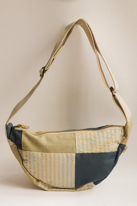 lemon stripes and teal patchwork bag on white background