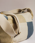 lemon stripes and teal patchwork crossbody bag on white background