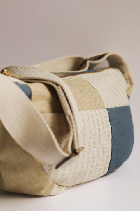 lemon stripes and teal patchwork crossbody bag on white background