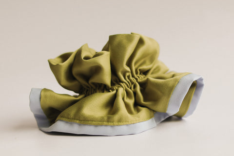 Green shoe cover on a beige background