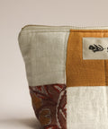 Patchwork pouch with a floral pattern on a beige background