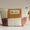 Patchwork pouch with a visible brand label on a neutral background