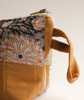 Fabric pouch with floral pattern on a white background