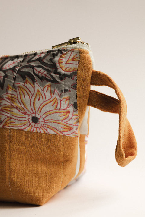 Fabric pouch with floral pattern on a white background