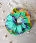 Colorful scrunchie on a white background with decorative elements