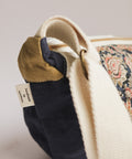 handmade by survviors tag moon bag