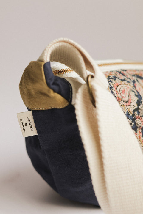 handmade by survviors tag moon bag