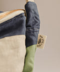 sage navy beige patchwork crossbody bag tag close up
