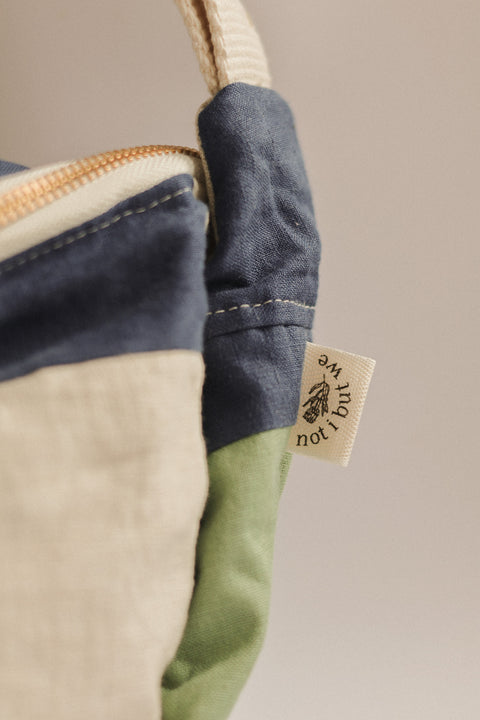 sage navy beige patchwork crossbody bag tag close up