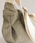 silver textured bag on white background