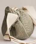 gray textured bag on a white background