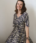 woman spinning in sisterhood dress