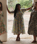three women wearing sisterhood dress