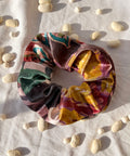 colourful velvet scurnchie on white background