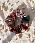 winter velvet scrunchie on white background with texture