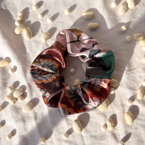 winter velvet scrunchie on white background with texture